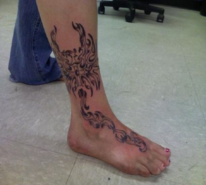 Tribal Phoenix Leg Tattoo